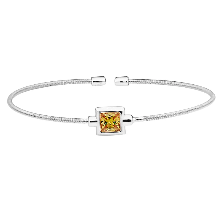 Colorful Bracelets For Party Wear-Rhodium Finish Sterling Silver Cable Cuff Bracelet with Princess Cut Simulated Citrine Birth Gem